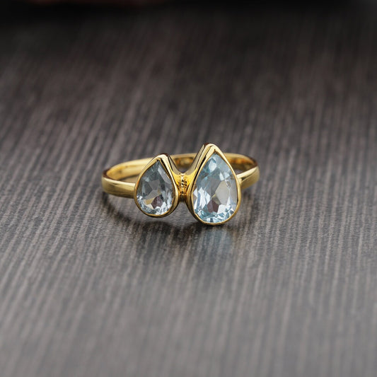 Faceted Pear Shape Blue Topaz Studded Stering Silver wth Gold Plated Ring